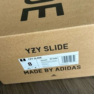 Yeezy slides size 8 new never worn.